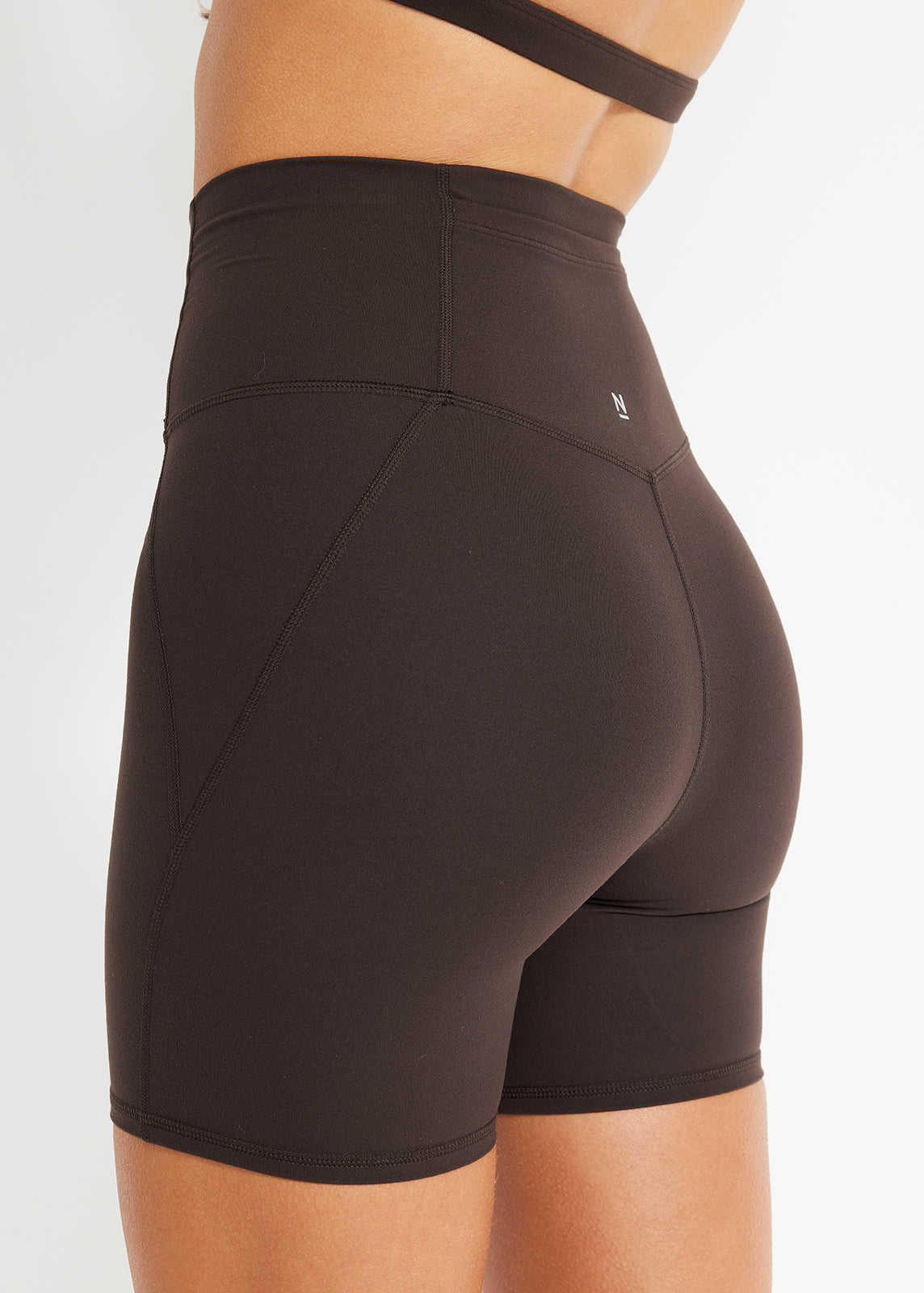 Back view of chocolate bike shorts with high waistband and soft, sculpted finish