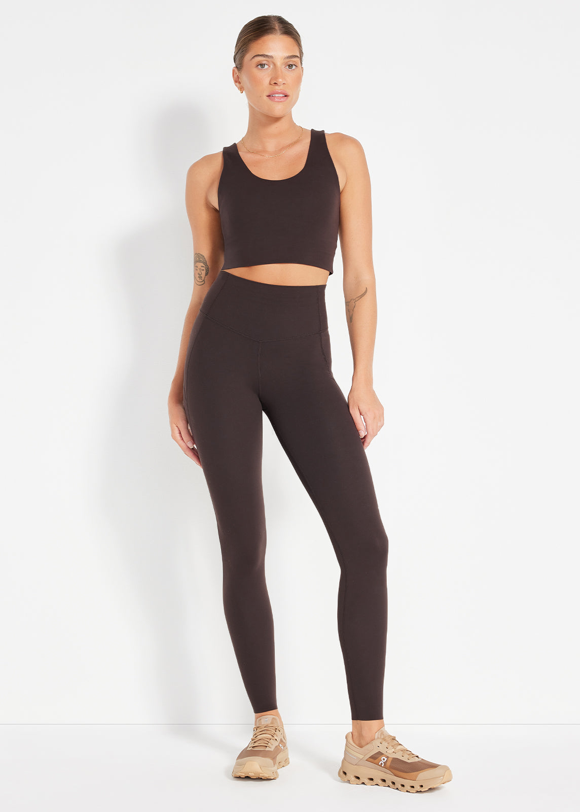 Espresso scoop crop and leggings styled with tan sneakers for a minimal active look