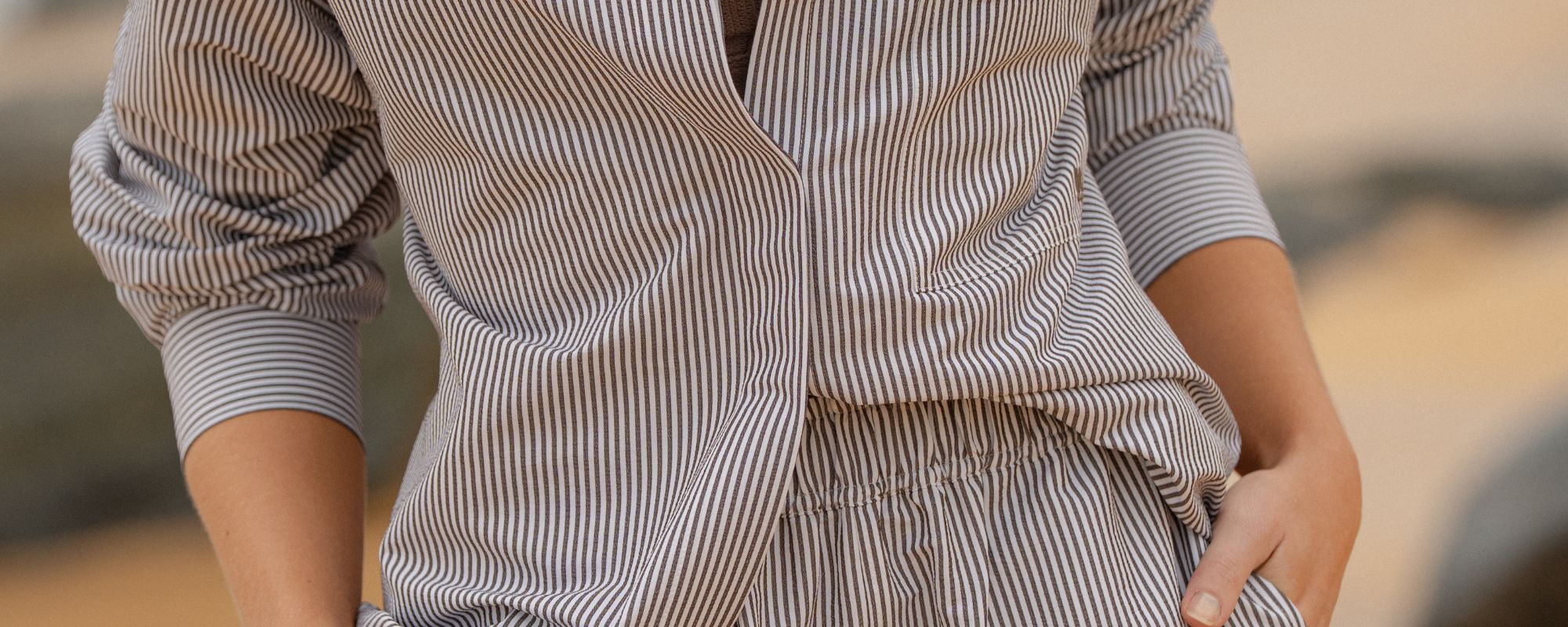 Close-up of striped long-sleeve top and matching shorts, showing fabric texture and relaxed fit.