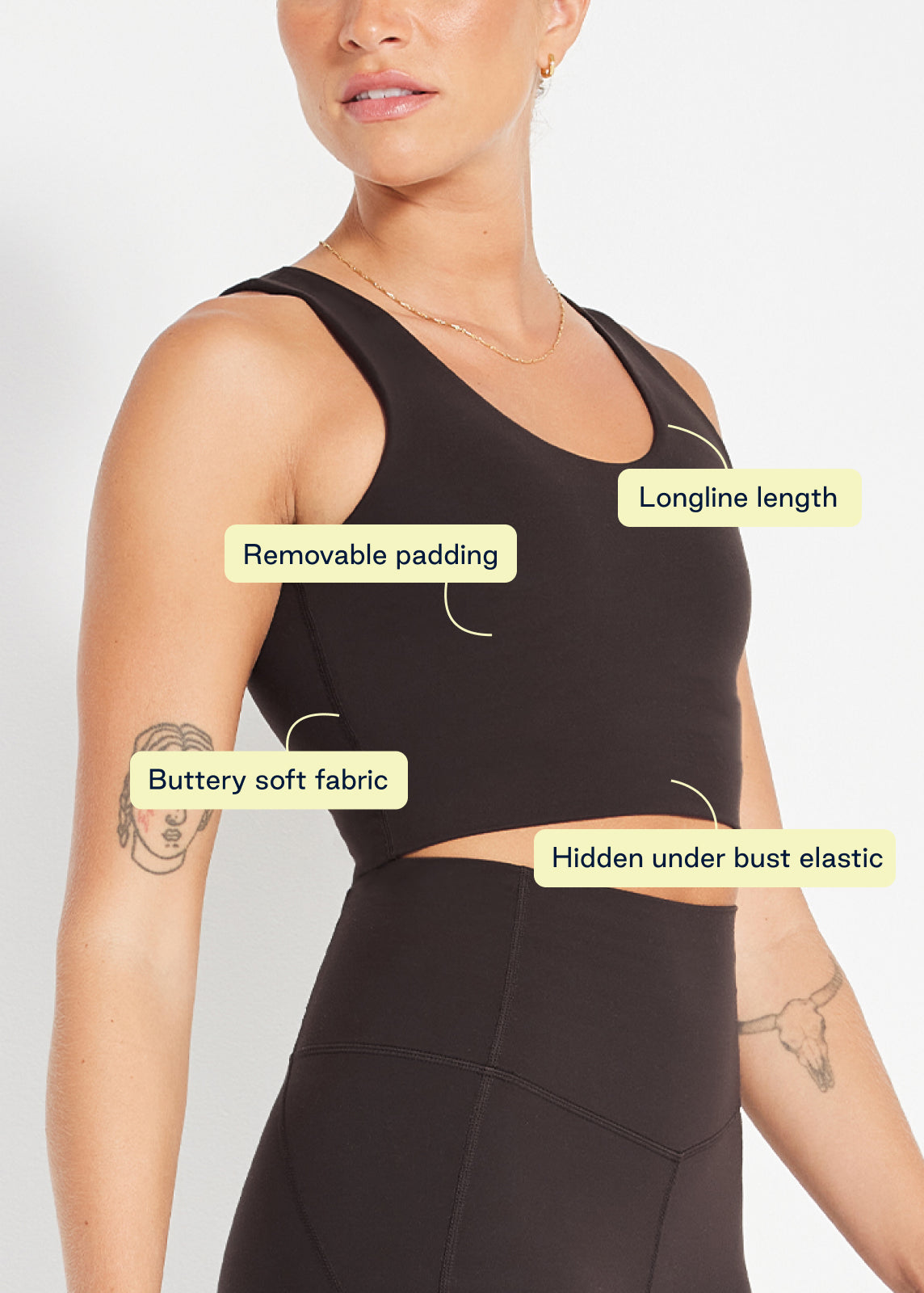Detail shot of black scoop crop showing longline length, soft fabric and hidden under-bust elastic